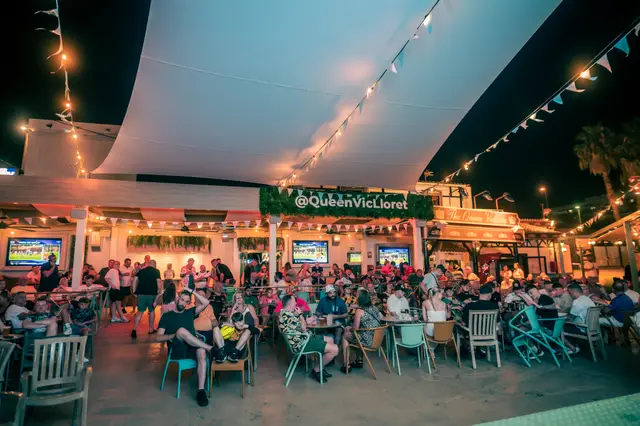 The terrace at night during a live match at Queen Vic